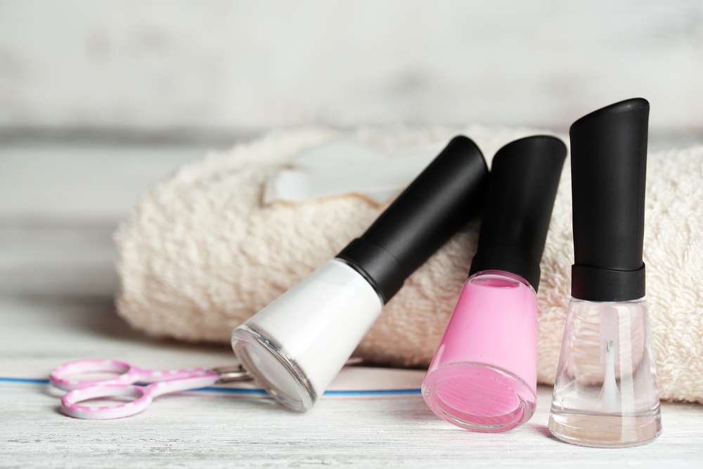 a group of nail polish bottles and scissors