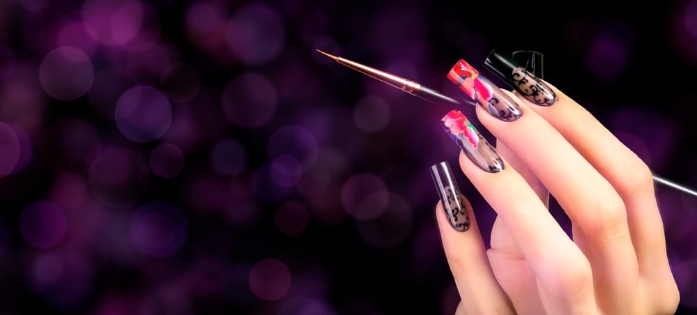 a hand nails with a brush