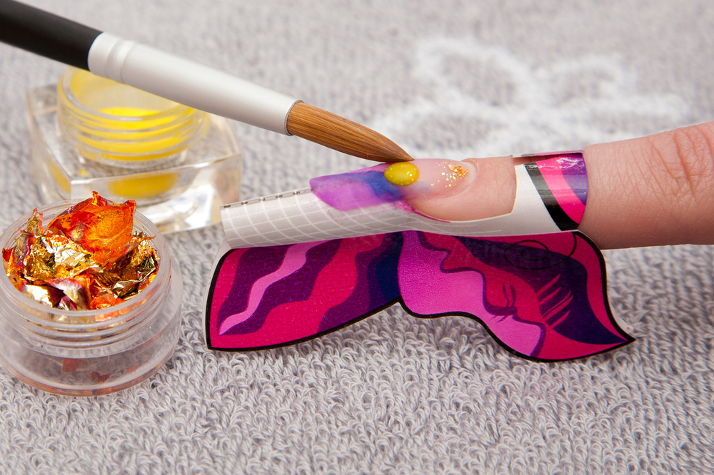 a finger painting a butterfly